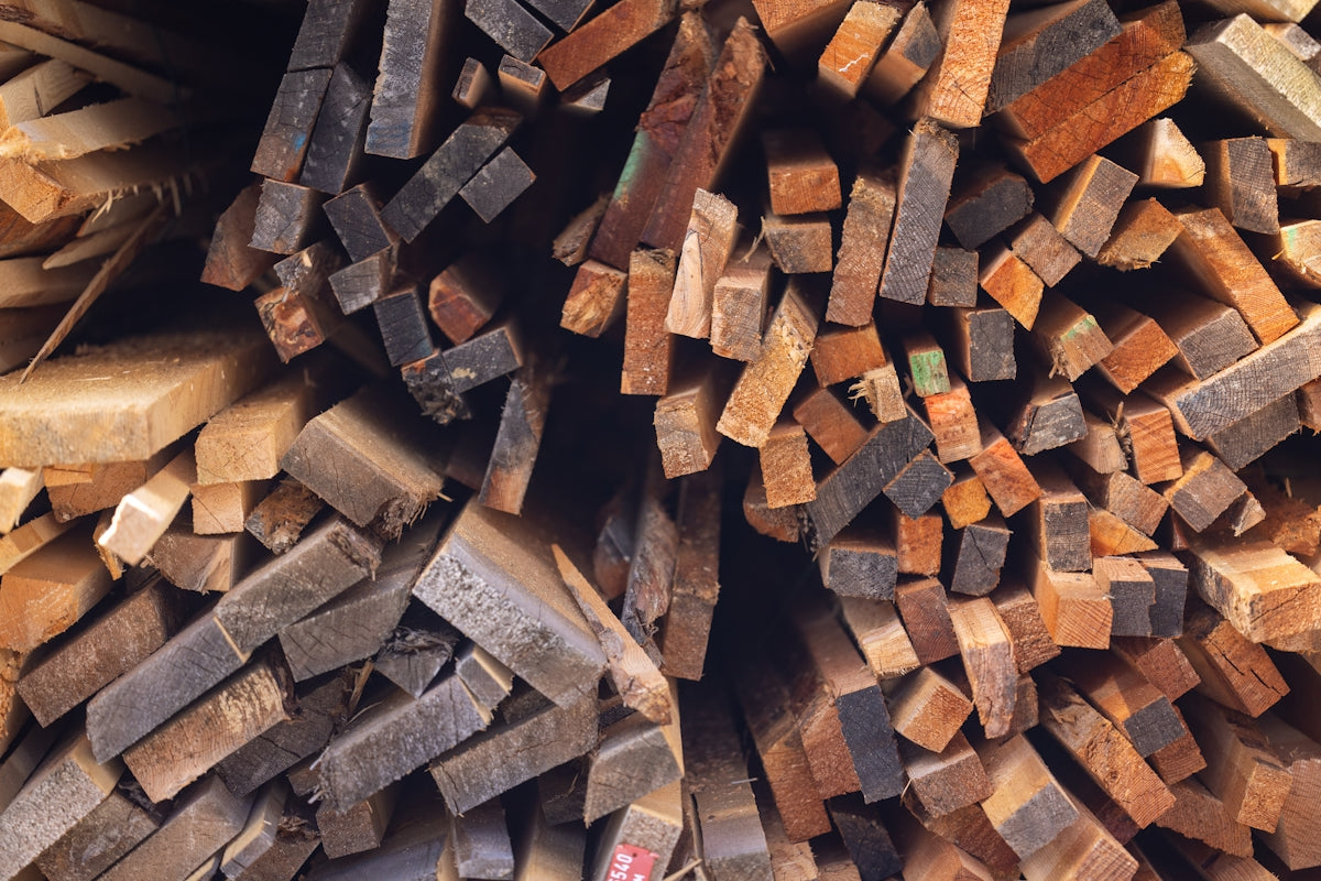 Pile of rough cut lumber and wood pieces.